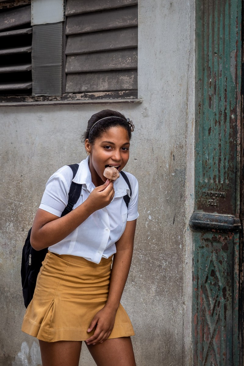 Girl eating ice cream, Havana, Cuba.