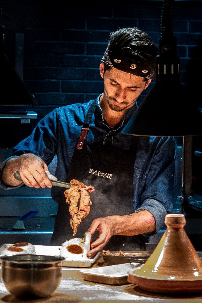 A chef preparing food at a restaurant in Gemmayzeh, Beirut, Lebanon.