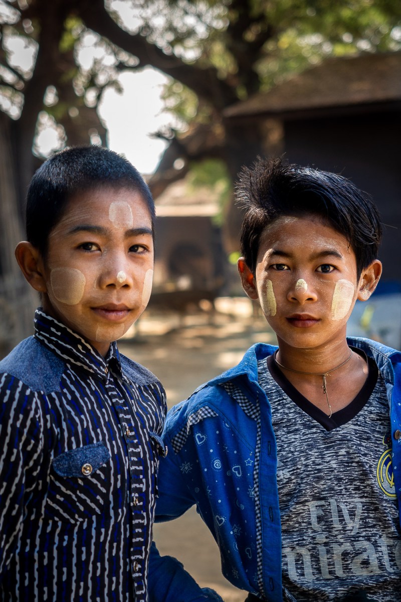 Two boys with traditional ”thanaka”, a white paste made of tree bark, Lekkapin Village, Myanmar.