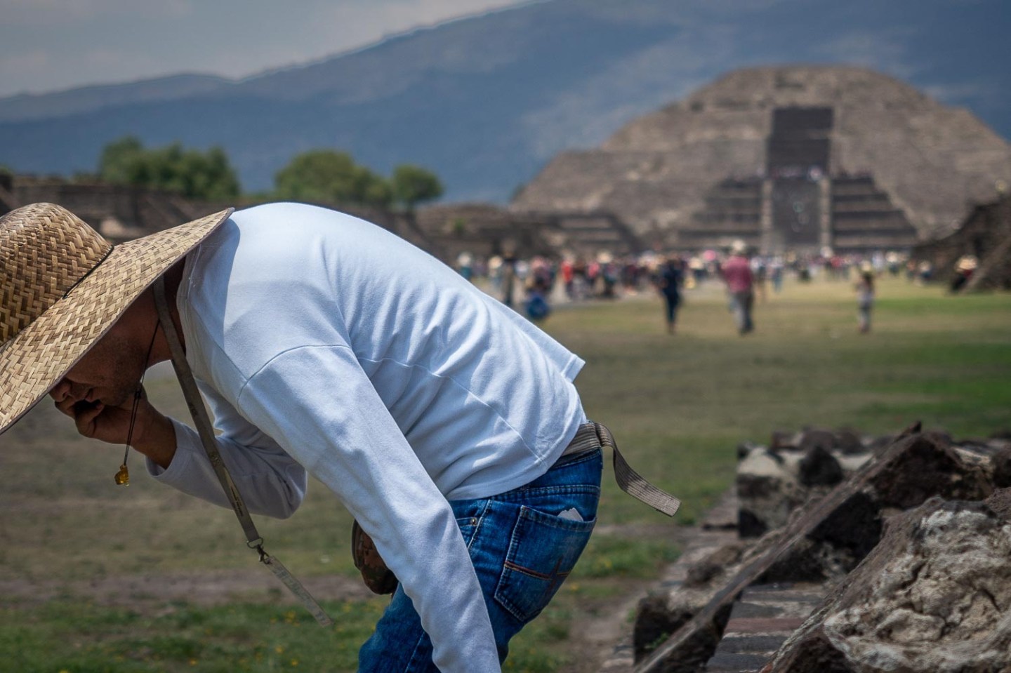 Man in a sombrero hat taking a rest, Teotihuacan, Mexico.